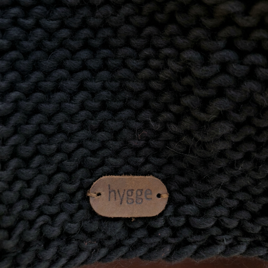 Black knit brand tag detail