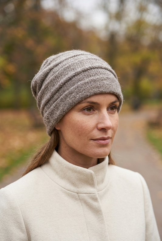Female model wearing oatmeal Parkdale beanie