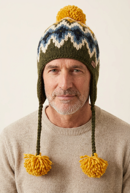 Male model aged 55–60 wearing the pilot hat
