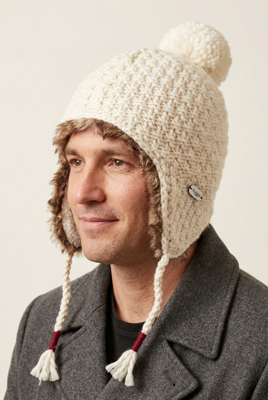 Male model wearing the ivory Aiden Earflap Hat